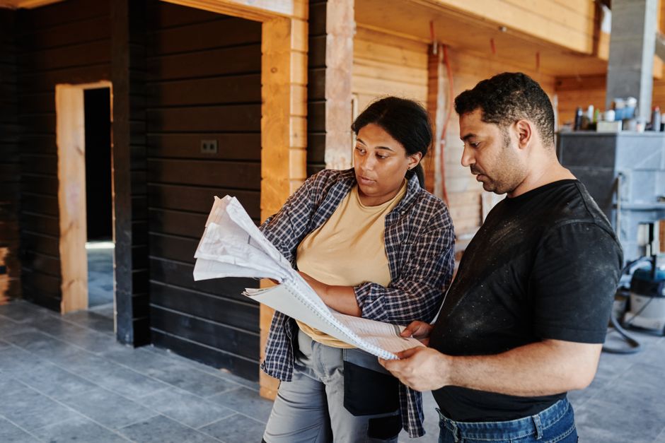 General contractor reviewing blueprints for a home renovation